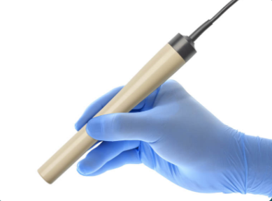 The Pintuition Probe held in a gloved hand
